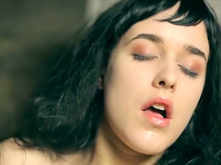 Raven-haired Emily J shaves her pussy and masturbates.