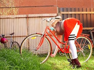 Blue-haired Cyclist in Only her Knee-socks