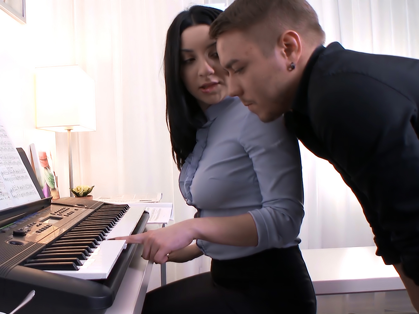 Threesome with piano teacher and students
