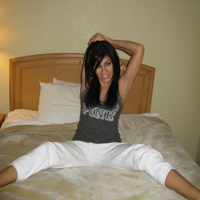 Stretching On The Bed - Raven Riley